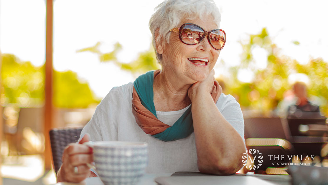A senior woman enjoying the warm summer temperatures. Stay safe with this senior summertime safety checklist.